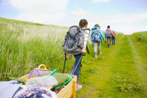 elementary students pulling field trip suppllies in wagon